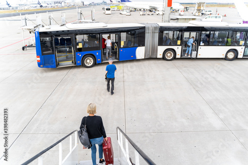 Photos Passengers at the airport with laggage getting off a plane