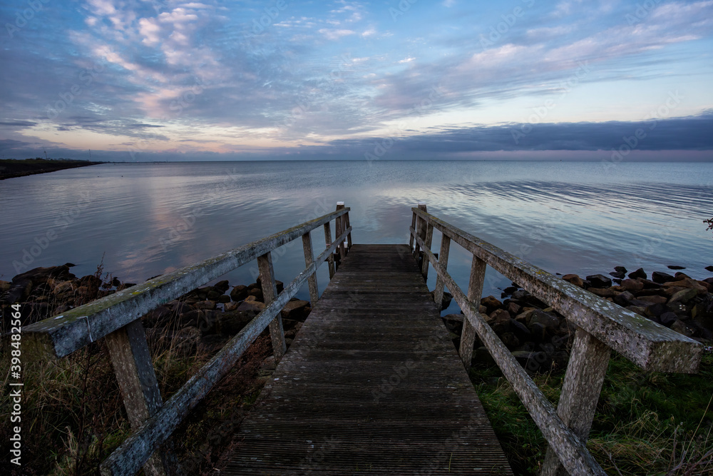 Fototapeta premium landscape of the shores of the northwest side of the IJsselmeer at sunset in the Netherlands