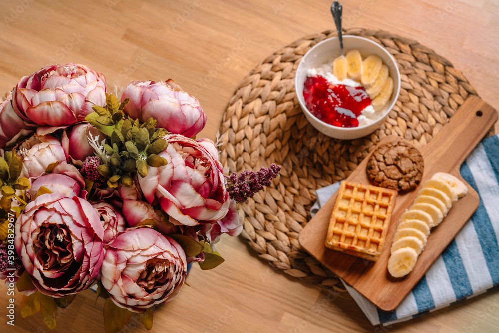 Colorful Breakfast with cottage cheese and jam and Viennese waffle