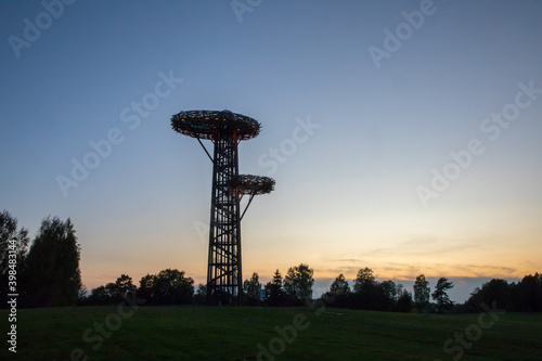 Silhouette of the  bird-nest looking public watchtower photo