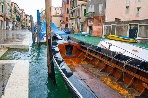 Boats and ancient houses in the channels of Venice, Venetian, Italy © hardyuno
