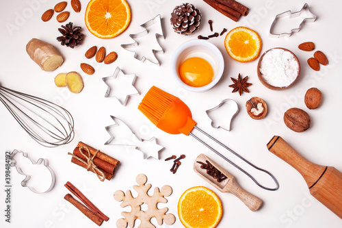 Ingredients and items for baking gingerbread. Spices, egg, orange. Christmas cooking. Flat lay style