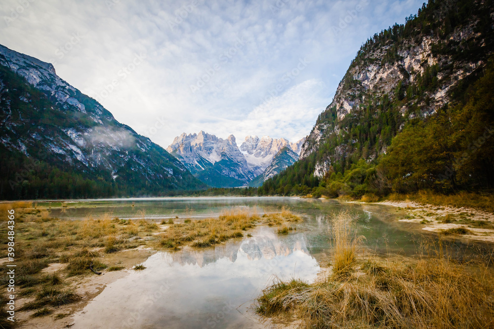Reflection in the Lake Toblach, Lago di Dobbiaca in South Tyrol, Italy