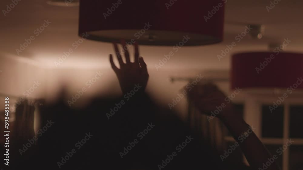 Party Goers With Their Hands Raised, Dancing Indoor. - Selective Focus