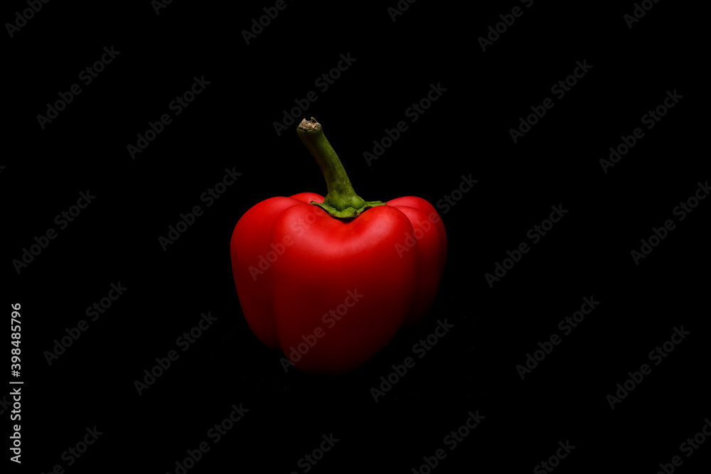 Red bell pepper on black background Red bell pepper on black background