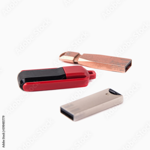 Three old USB flash drives isolated on a white background