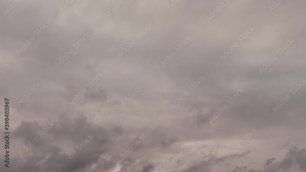 Time-lapse of clouds moving fast across the sky during sunset Time-lapse of clouds moving fast across the sky during sunset