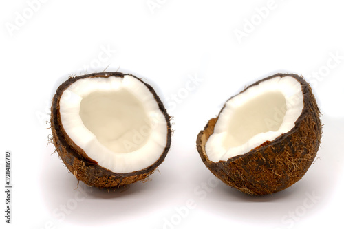 Two coconut half on white background. Fruit background. Natural background. Tropical nature. White background.