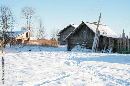 old wooden hut in the snow