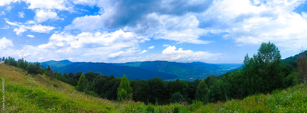 Panorama view of mountains. Beautiful landscape. Sky with clouds. Amazing nature. Wanderlust concept.