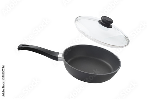 Fényképezés Flying frying pan and glass lid isolated on white background