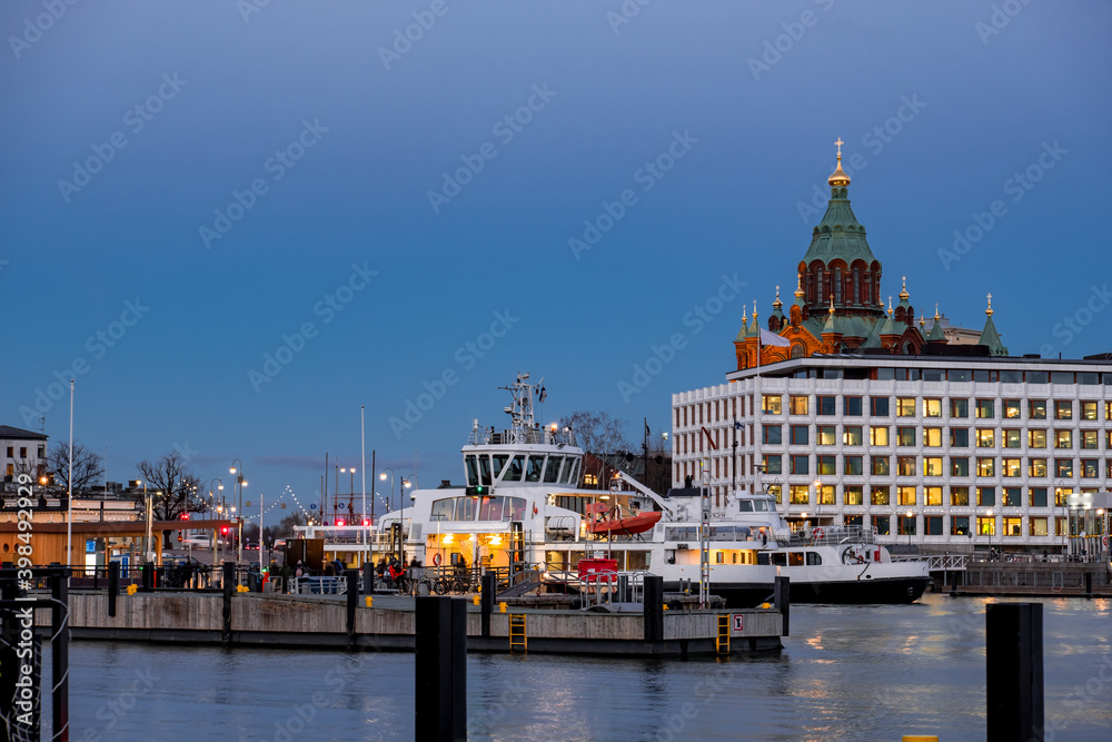 The ferry ship is arriving to Helsinki port in the evening, Finland.