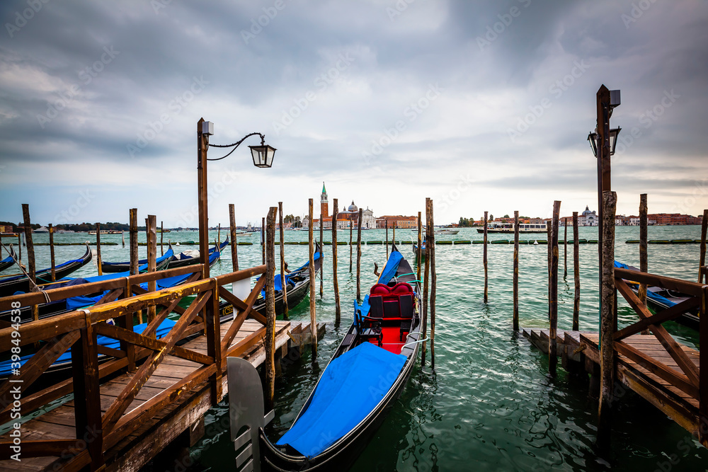 Traditional gondolas at the shore of Piazza San Marco in Venice, Venetian, Italy