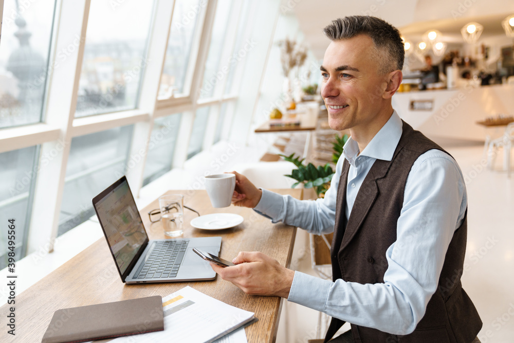 Confident handsome businessman in smart clothes Confident handsome businessman in smart clothes