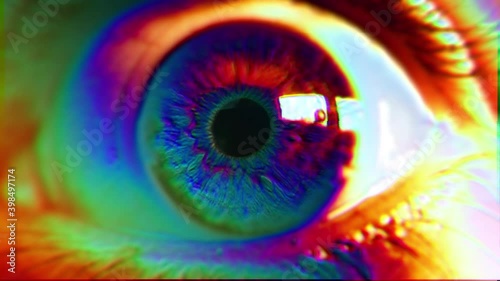 Psychedelic Eye Color Spectrum Glitch. Extreme close up of an wide opened eye in a psychedelic effect. Color spectrum effect photo