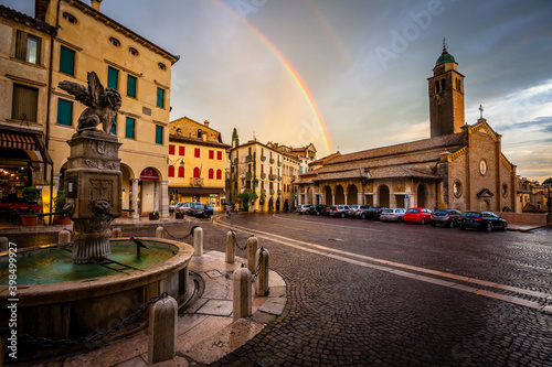 Dark clouds and a rainbow over the village of Asolo in Venetian, Italy