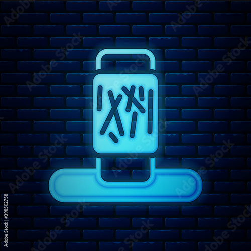Glowing neon Cat scratching post with toy icon isolated on brick wall background.  Vector.
