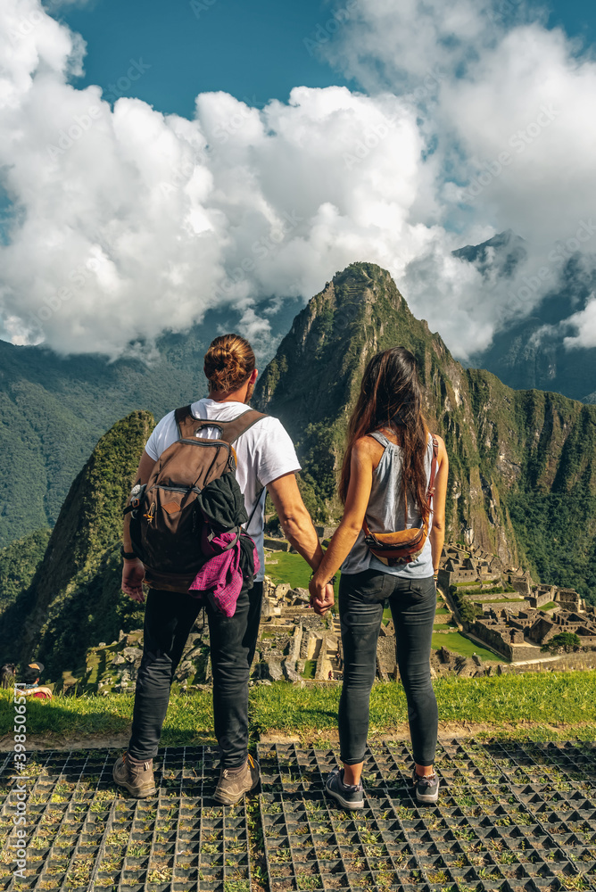 Man and woman hiking on top of a mountain
