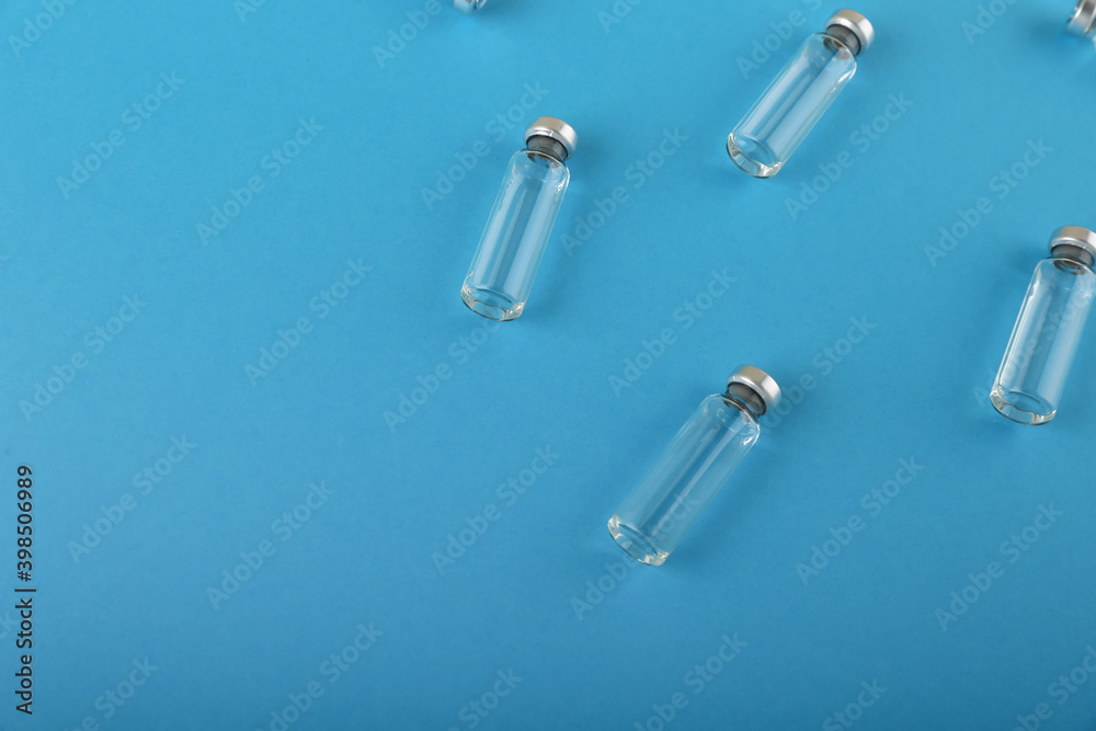 vaccine vials are on blue medical background top view vaccine vials are on blue medical background top view