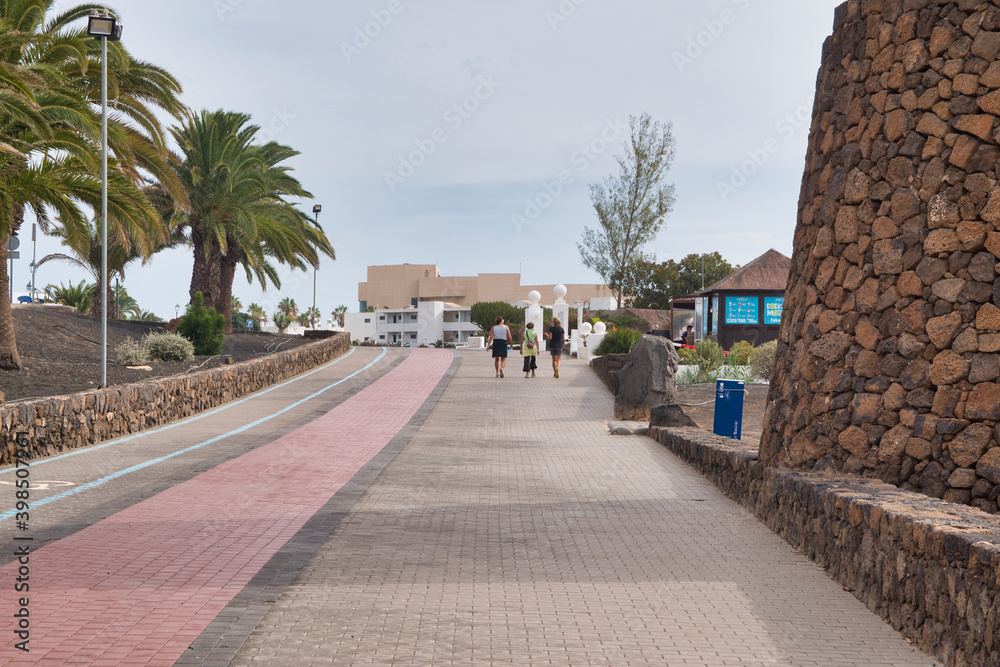 Lanzarote, Spain - December 1, 2020 : Image of the pedestrian promenade in Costa Teguise, Lanzarote island