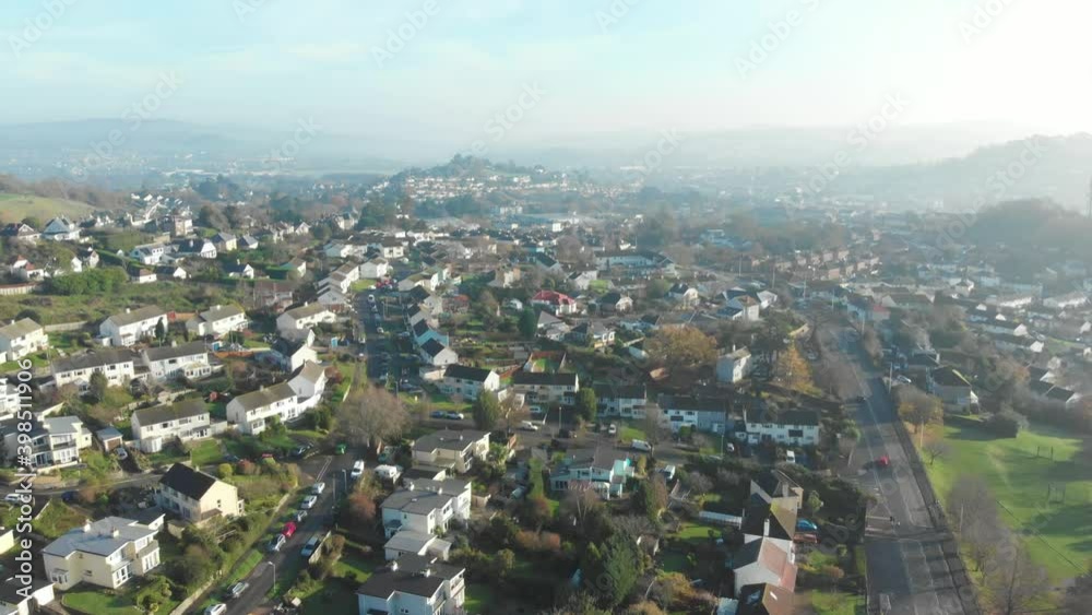 Early morning mist over suburban neighbourhood in town - drone shot Early morning mist over suburban neighbourhood in town - drone shot