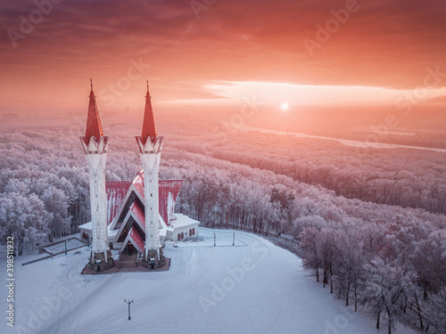 Aerial drone view of the famous landmark of Ufa and Bashkiria - Lala Tulip mosque during sunset in winter season. Islamic religion and muslim culture in Russia concept photo