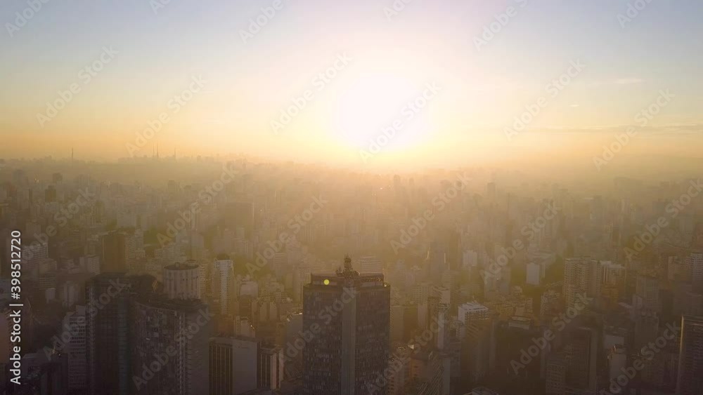 flight into the sun on City centre Of Sao Paulo, near republica at sunset flight into the sun on City centre Of Sao Paulo, near republica at sunset