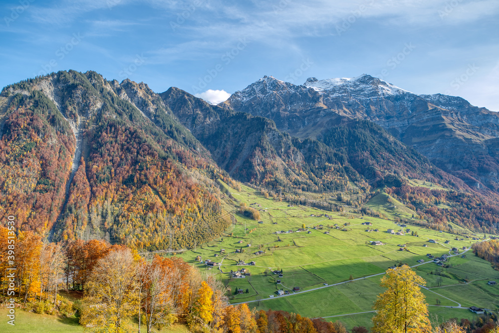 Charming autumn landscape in Swiss Alps. Colorful autumn scene of Swiss Alps. Location: Linthal, Canton Glarus, Switzerland, Europe