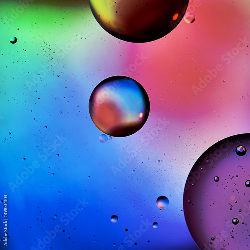 colorful oil balls on bright color background