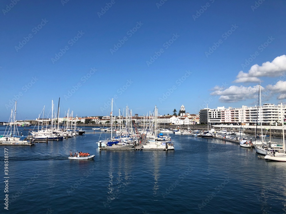 View over the Marina of the City of Ponta Delgada, with with anchored boats and yachts. São Miguel Island. Azores, Portugal