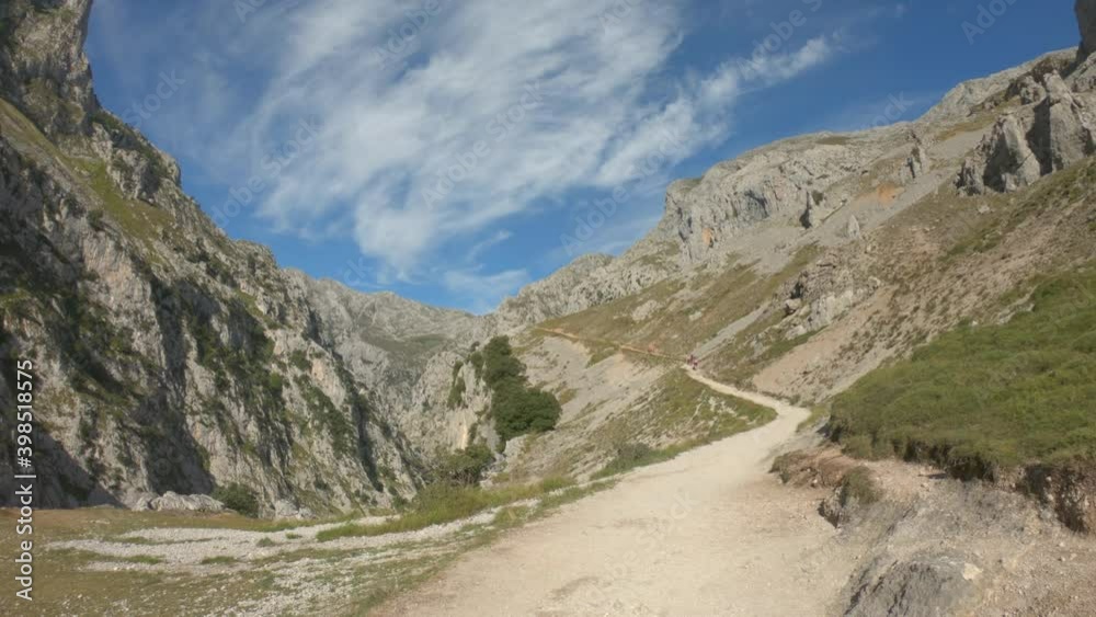 DOLLY SLOW - The Cares Route in the heart of Picos de Europa National Park, Cain-Poncebos, Asturias, Spain. Narrow and impressive canyon between cliffs, bridges, caves, footpaths and rocky mountains. DOLLY SLOW - The Cares Route in the heart of Picos de Europa National Park, Cain-Poncebos, Asturias, Spain. Narrow and impressive canyon between cliffs, bridges, caves, footpaths and rocky mountains.