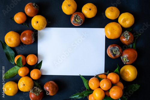 white christmas frame  bows and orange tangerines on a dark background