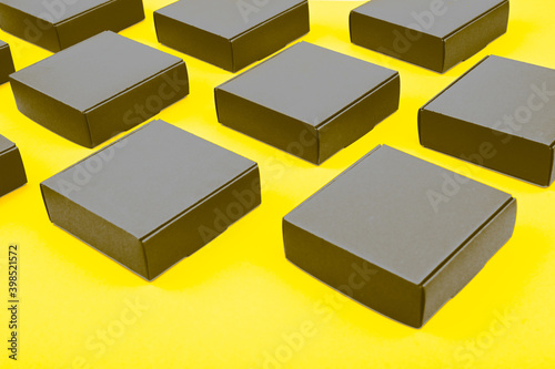 Gray bulk boxes on a yellow background. Color of the year 2021.