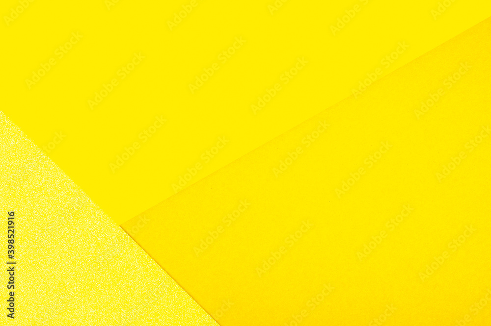 Abstract paper geometric background in shades of yellow. Color of the year 2021 illuminating Abstract paper geometric background in shades of yellow. Color of the year 2021 illuminating