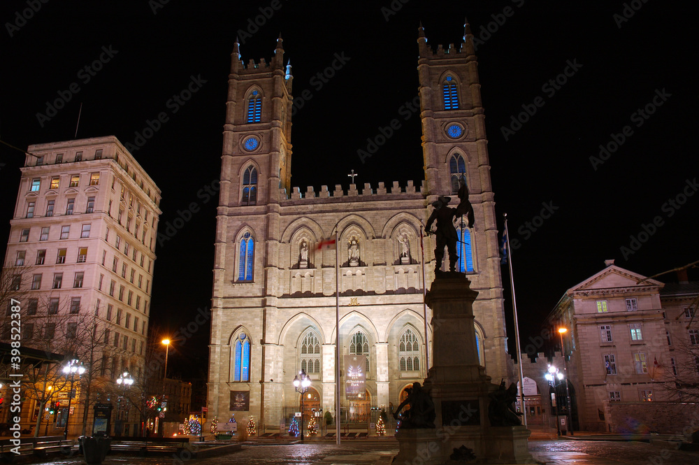 Montreal Notre Dame Basilica at night with Statue