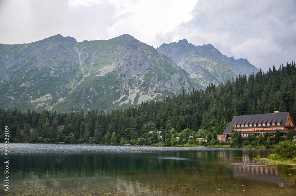 Fototapeta premium View to Lake Popradske pleso 1494m with mountain hotel in High Tatras, Slovakia. Popular travel and hiking destination 