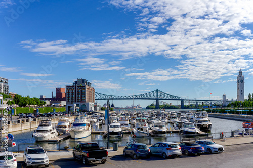 Port d'escale Marina in old harbour, Montreal. Clock Tower and Jacques Cartier Bridge at the background. Quebec, Canada.