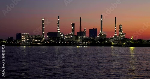 Oil refinery and sunrise at the Chao Phraya River, Thailand, petrochemical Industrial, oil refinery and oil industry, Dec 05, 2020.