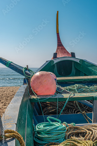 Arte Xavega typical portuguese old fishing boat on the beach in Paramos Espinho Portugal. photo
