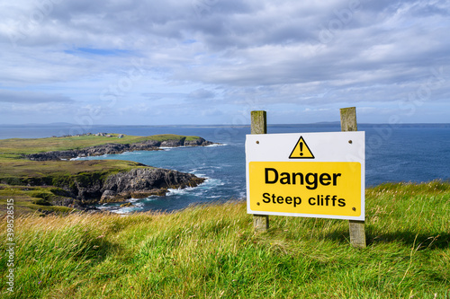 UK, Scotland, Warning sign in front of steep cliffs ofÔøΩTiumpanÔøΩHead photo