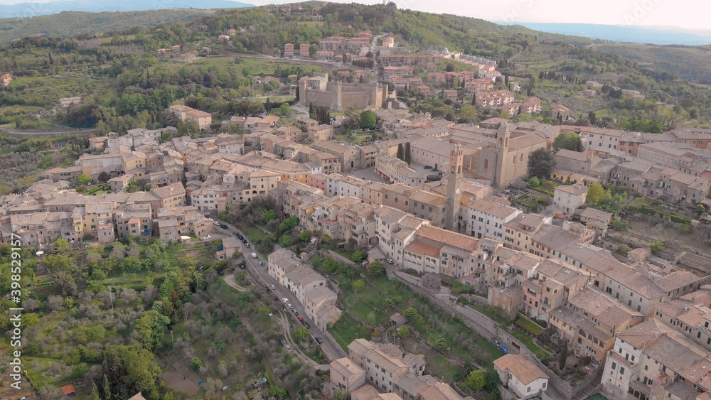 amazing italian town Montalcino in mountains in summer day, aerial view, picturesque old living houses