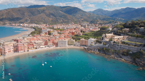 Breathtaking 4K aerial view of beautiful Sestri Levante town in mediterranean sea, incredible turquoise sea.