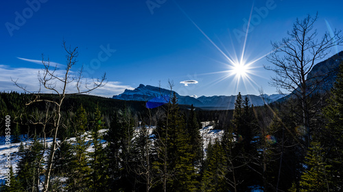 sunstar in mountains