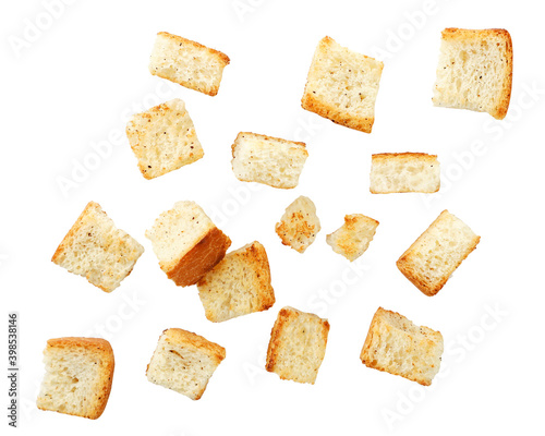 Wheat square croutons croutons falling on a white background. Isolated photo
