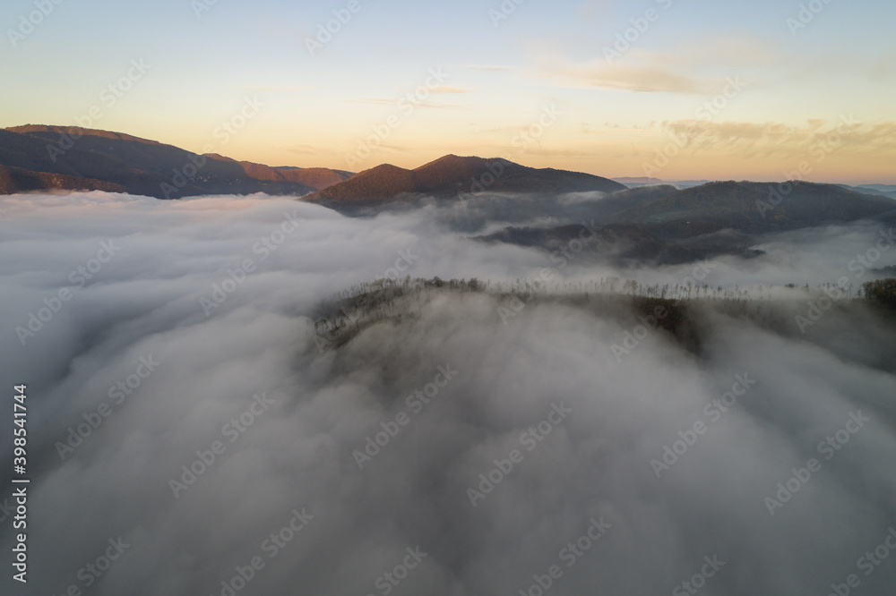 Flying through the clouds at dawn above the jumping lake in Rieti Flying through the clouds at dawn above the jumping lake in Rieti