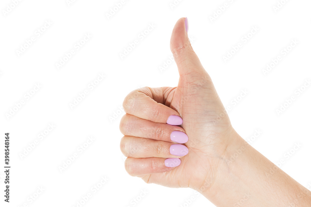 Woman hand with light purple manicure showing thumbs.Isolated on white background Woman hand with light purple manicure showing thumbs.Isolated on white background
