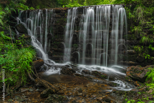 Fototapeta Naklejka Na Ścianę i Meble -  Waterfall on Divoky creek near Kouty nad Desnou village in summer day