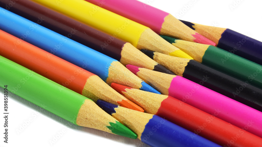 colored pencils arranged head to head isolated on a white background. copy paste space colored pencils arranged head to head isolated on a white background. copy paste space