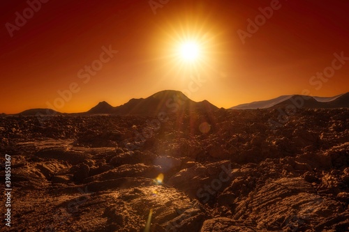 This photograph showcases a pahoehoe lava flow from ancient cinder cone landscape, reminiscent of mars mud flows. photo