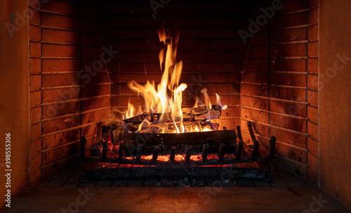 Slika na platnu Fireplace, fire burning, cozy warm fireside, christmas home.